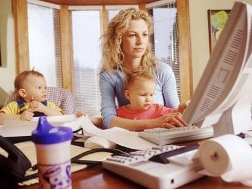 woman-working-at-home-with-kids woman at computer working at home with kids