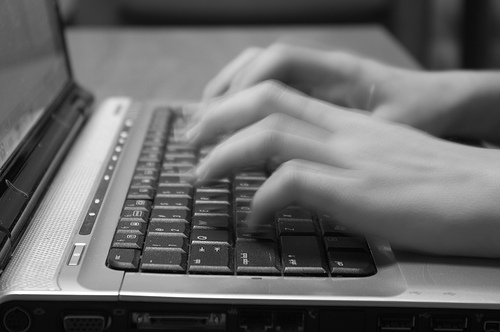 typing on laptop