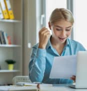 Excited woman reading mail letter with great news