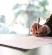 Businessman Signing Contract or Legal Papers