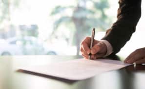 Businessman Signing Contract or Legal Papers