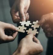 mobile jigsaw puzzle pieces business cooperation concept teamwork and cooperation Businessmen join a jigsaw team, charity, volunteerism, unity, teamwork.