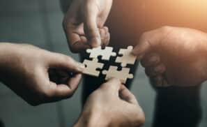 mobile jigsaw puzzle pieces business cooperation concept teamwork and cooperation Businessmen join a jigsaw team, charity, volunteerism, unity, teamwork.